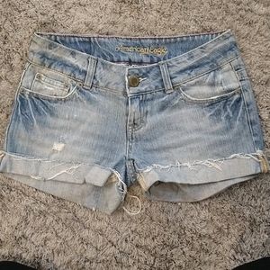 Distressed AE blue denim shorts